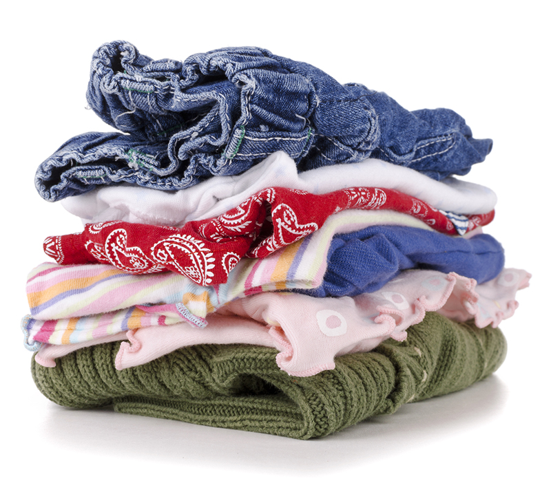 pile of colorful children's clothing on a white background.