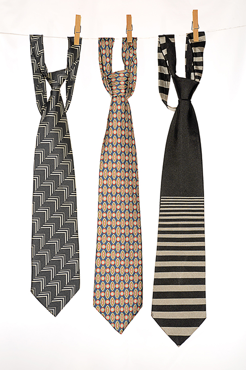 Three Ties Hanging on a Rope with Wooden Pegs.